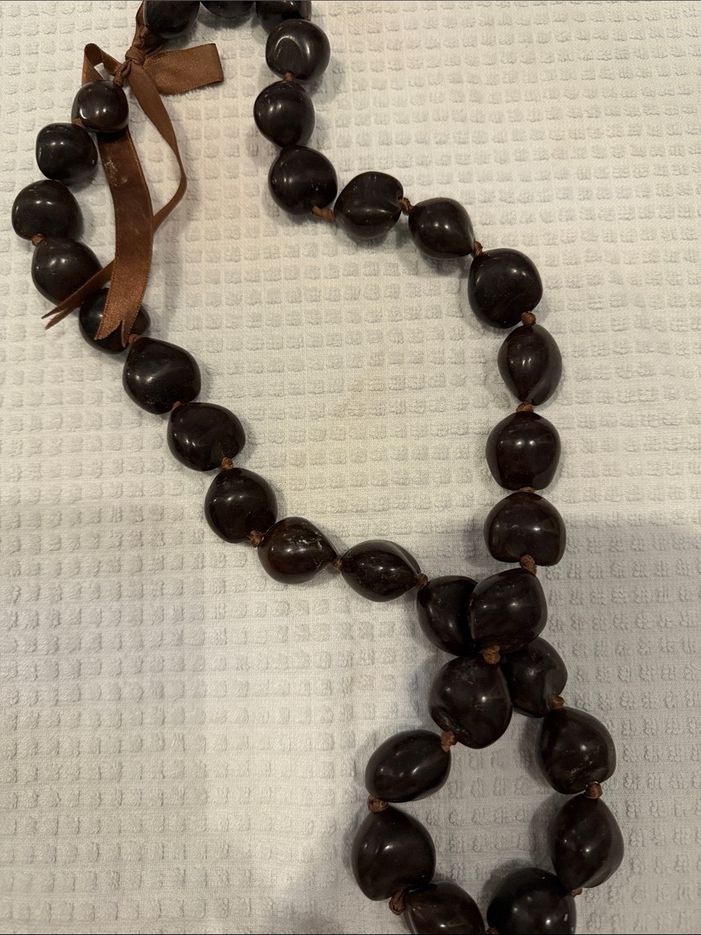 Hand-Tied Dark Brown Kukui nut Beaded lei with Ribbon Accent